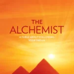 The Alchemist Special Illustrated Edition book cover by Paulo Coelho featuring a desert landscape with a sun symbol.