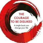 The Courage to Be Disliked book cover featuring minimalist Japanese design with bold typography.
